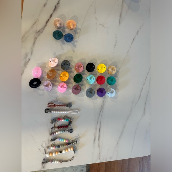 Ryan and Rose Cutie pats, Cutie clips, a teether, and some Itzy ritzy mixed in! - Picture 2 of 5